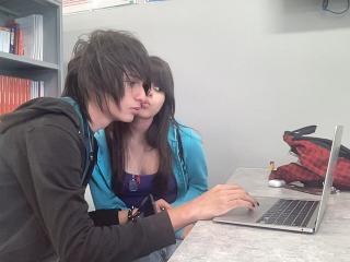 These two lovebirds in my class are taking a photo.